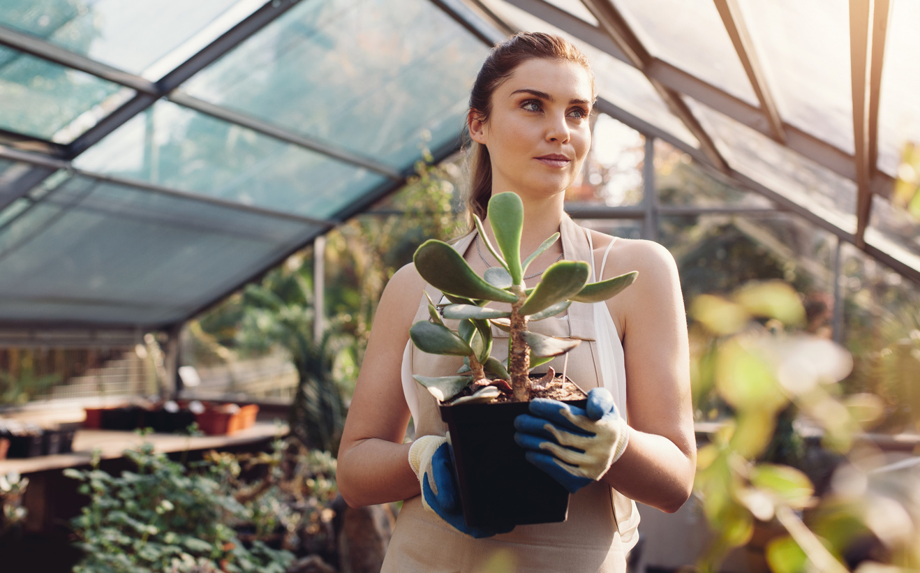 Female Worker Working at Garden Center