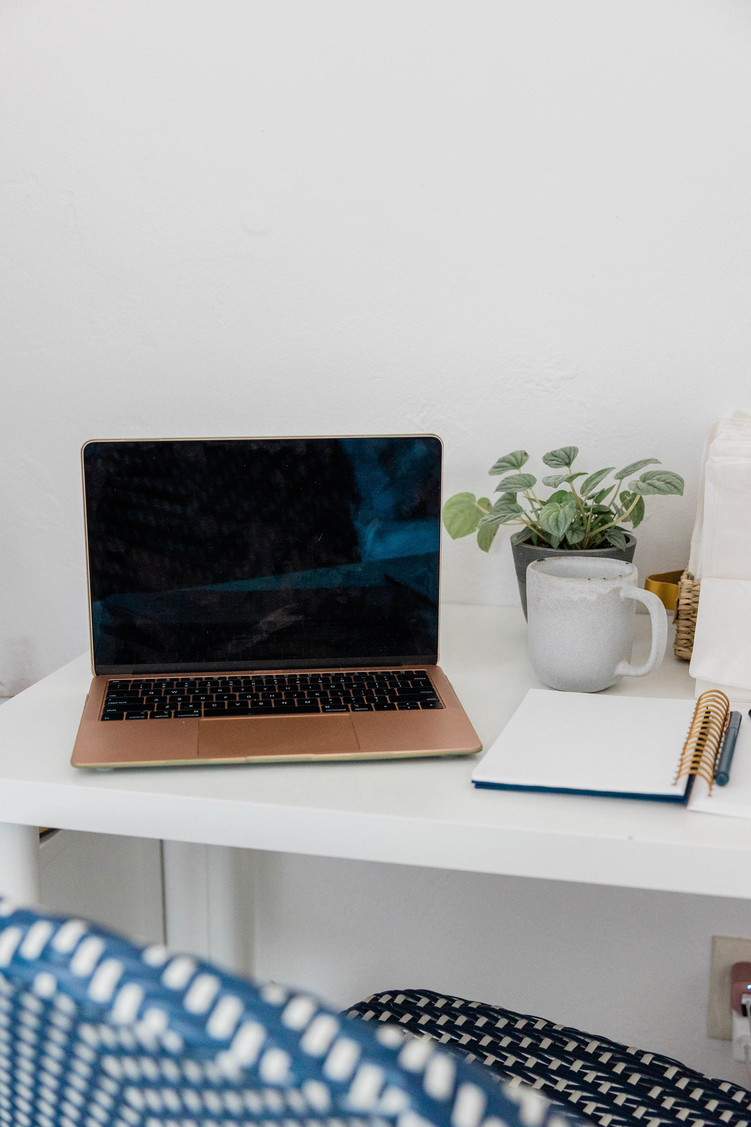 Laptop and Notebook on White Desk